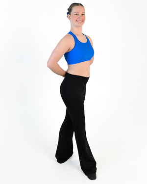 Young dancer wearing the Avery racerback dance crop top in Electric Blue