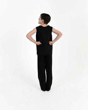 Young dancer wearing the Essential Boys Straight Leg Dance Pant in Black, alternate view