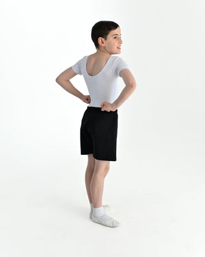 Young dancer wearing the Essential Boys Basic Dance Shorts in Black, alternate view