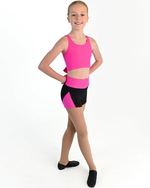 Young dancer wearing the Aura tie back dance crop top in Electric Pink