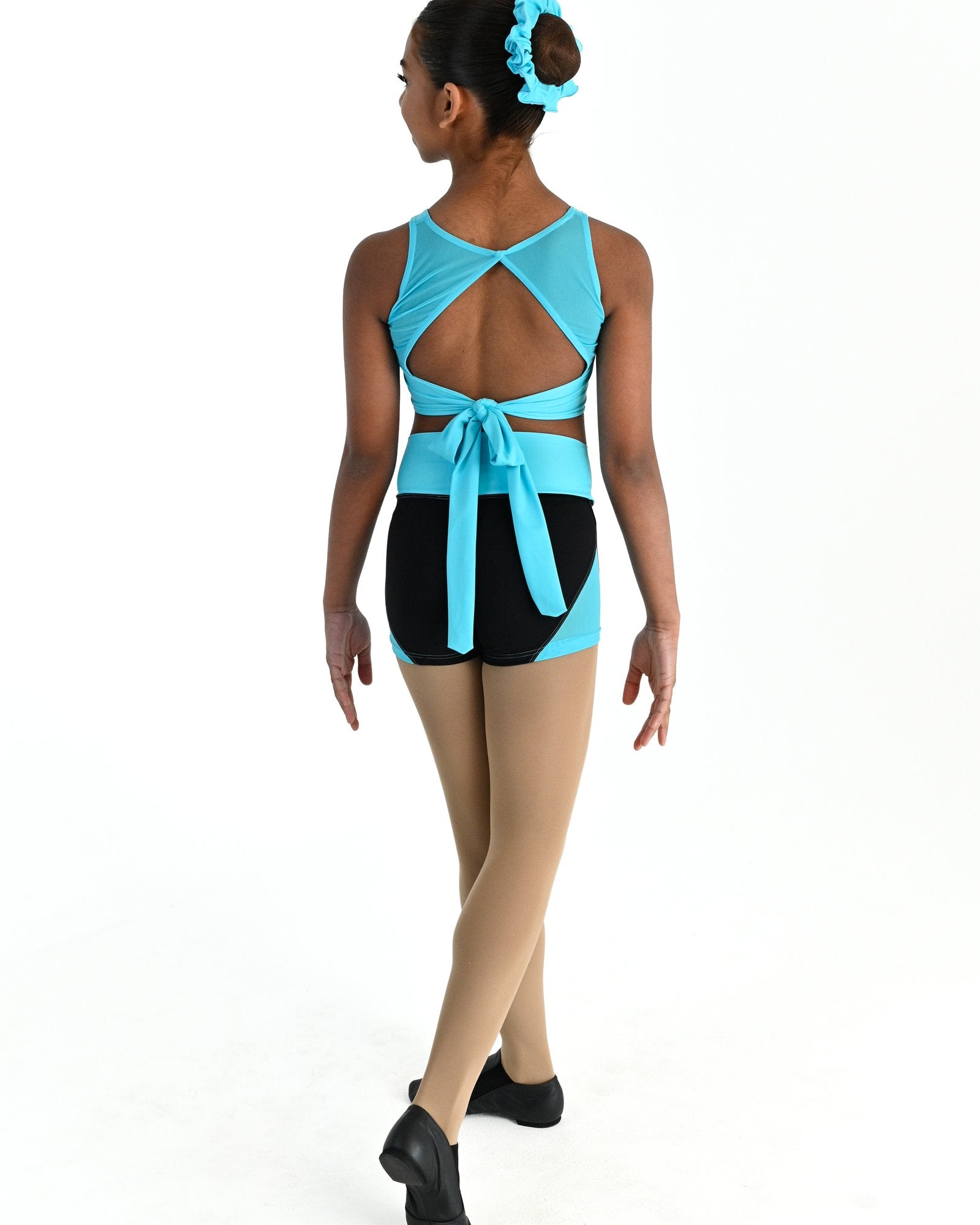 Young dancer wearing the Aura tie back dance crop top in Lagoon, alternate view