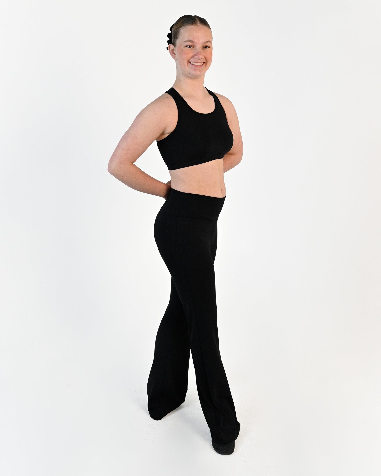 Young dancer wearing the Avery racerback dance crop top in Black