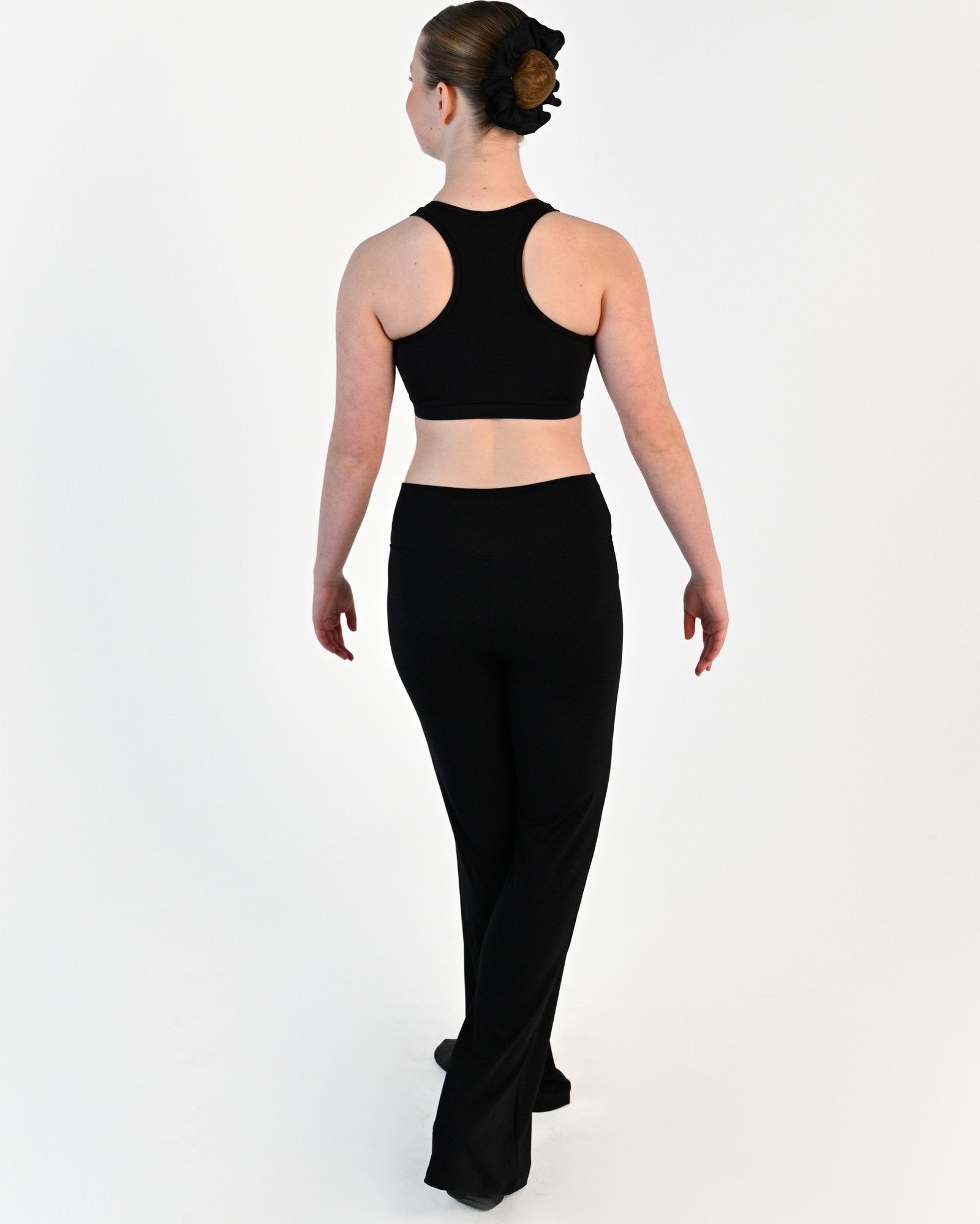 Young dancer wearing the Avery racerback dance crop top in Black, alternate view