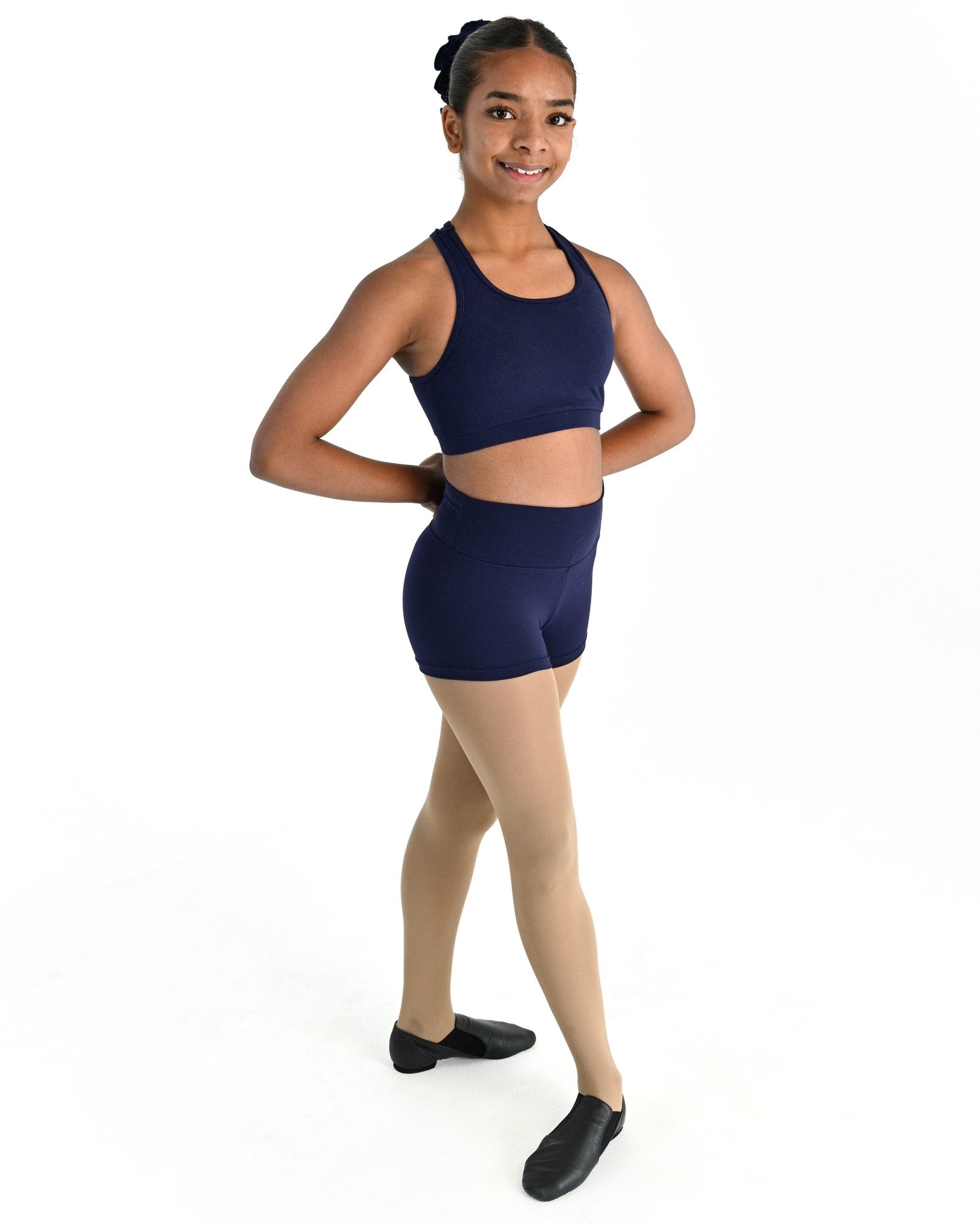Young dancer wearing the Avery racerback dance crop top in Navy