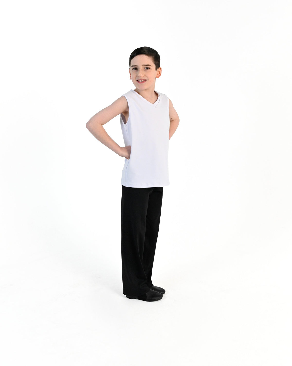 Young dancer wearing the Essential Boys Straight Leg Dance Pant in Black