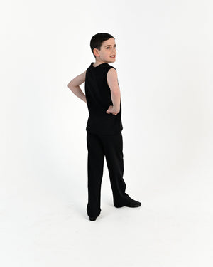 Young dancer wearing the Essential Boys Straight Leg Dance Pant in Black, alternate view
