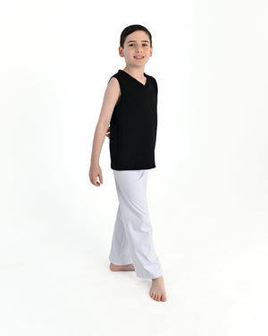 Young dancer wearing the Essential Boys Straight Leg Dance Pant in White