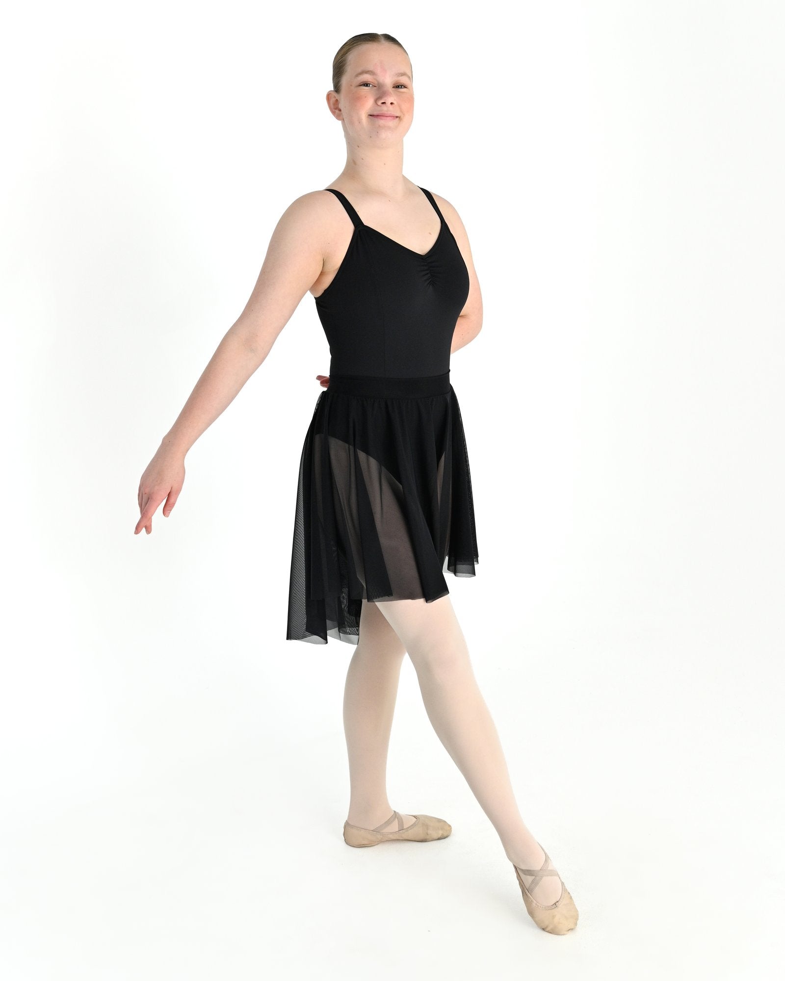 Young dancer wearing the Celeste high low stretch mesh ballet skirt in Black