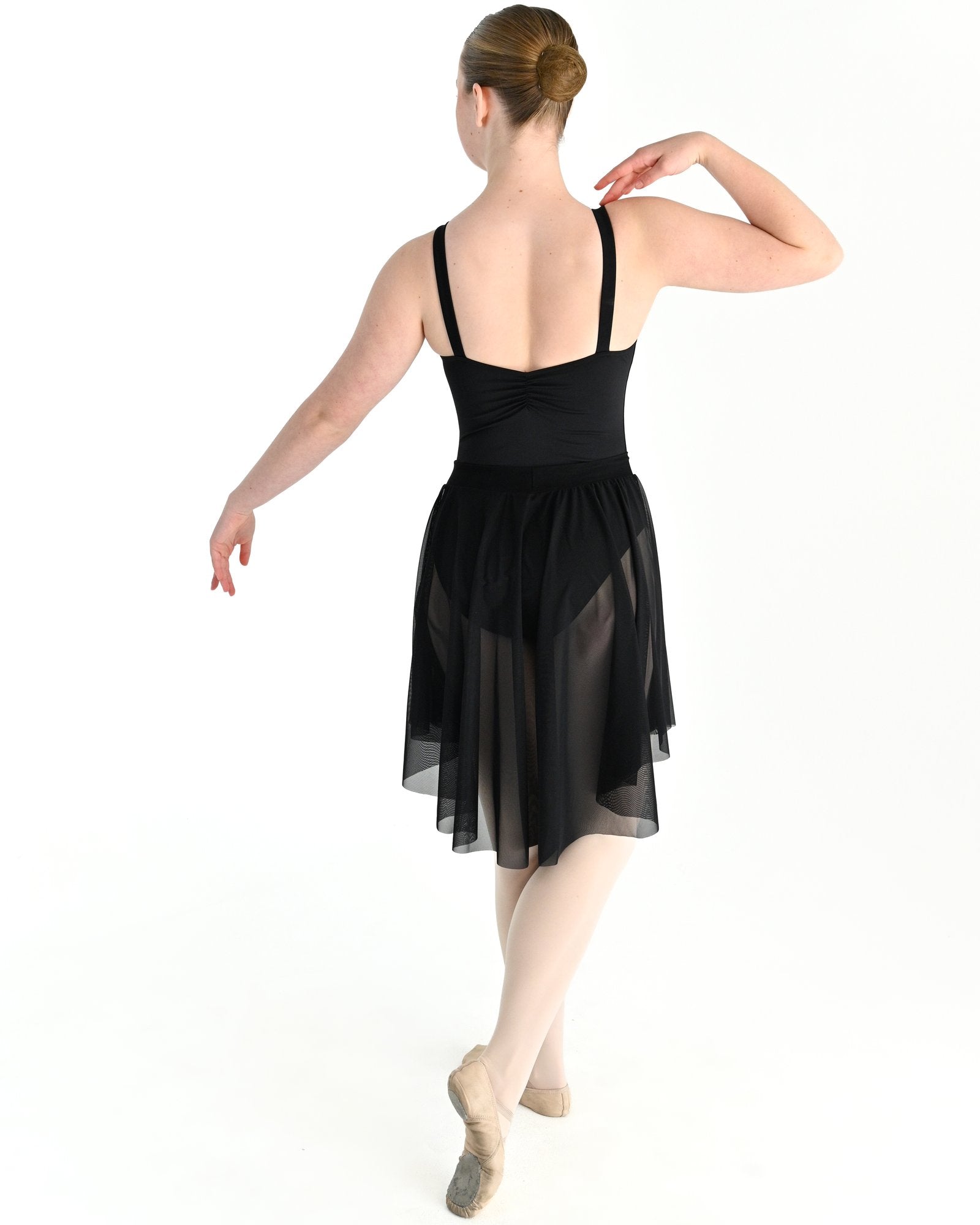 Young dancer wearing the Celeste high low stretch mesh ballet skirt in Black, alternate view
