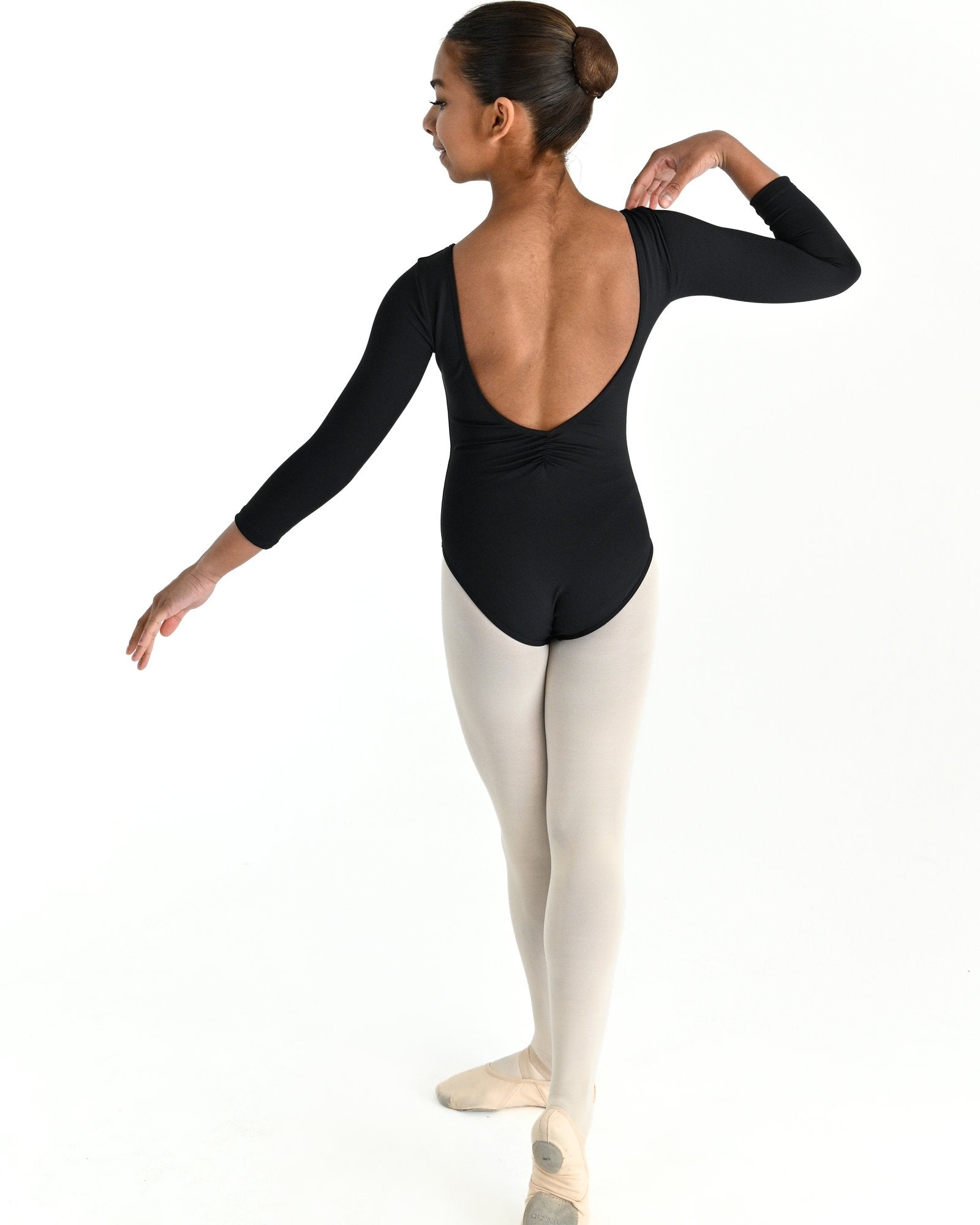 Young dancer wearing the Essential 3/4 sleeve dance leotard with low back in Black, alternate view