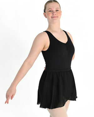 Young dancer wearing the Georgette Pull-On Ballet Wrap Skirt in Black