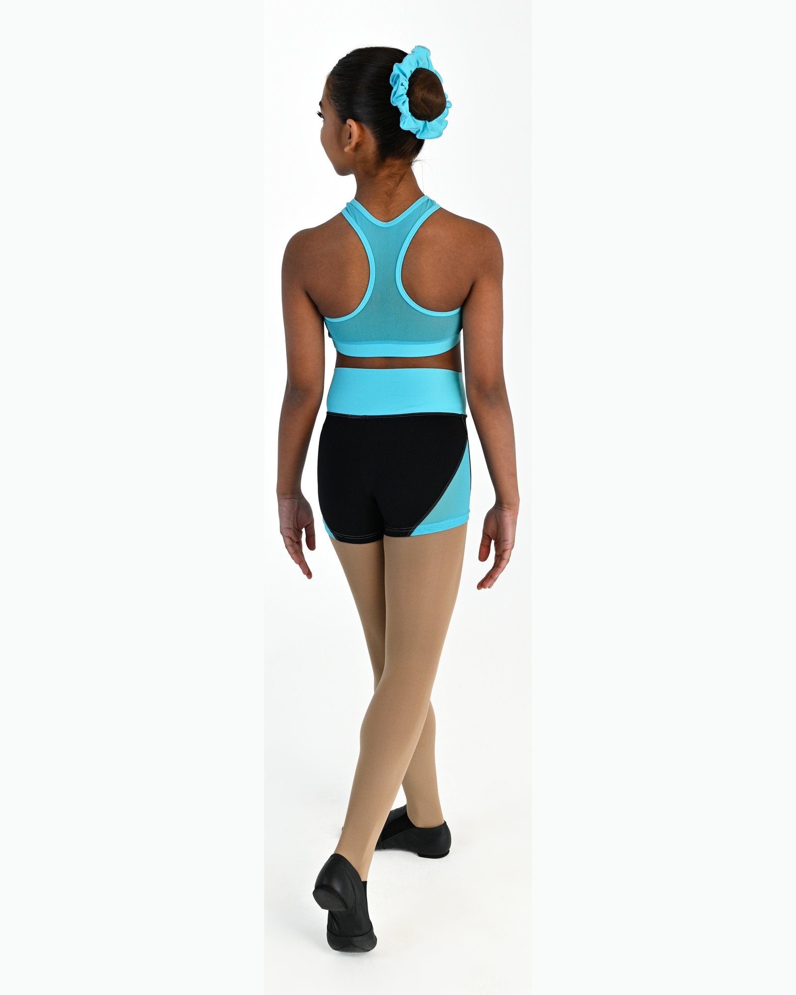 Young dancer wearing the Electra crossover racerback dance crop top in Lagoon, alternate view