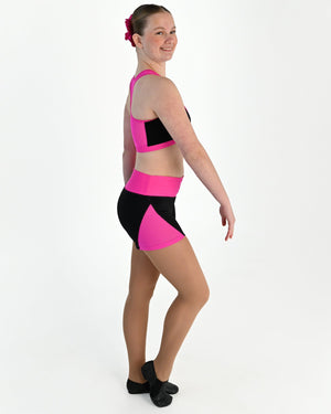 Young dancer wearing the Electra mesh panel high waisted dance shorts in Electric Pink, alternate view