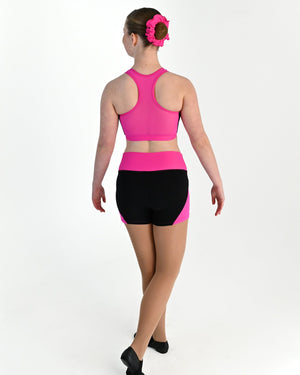 Young dancer wearing the Electra mesh panel high waisted dance shorts in Electric Pink, alternate view