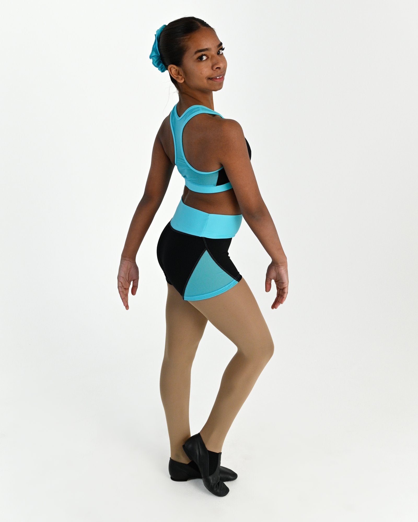 Young dancer wearing the Electra mesh panel high waisted dance shorts in Lagoon, alternate view