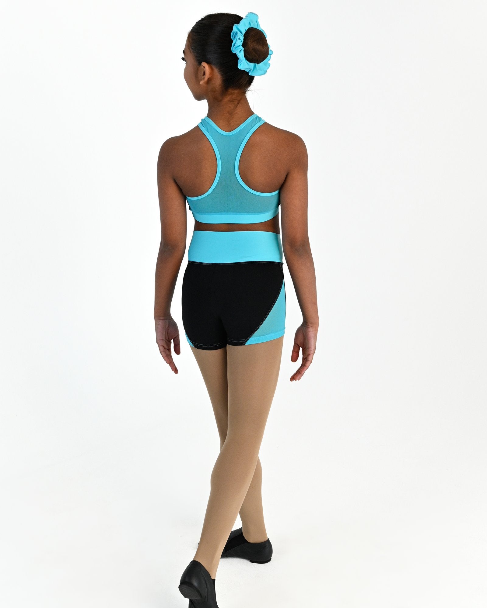 Young dancer wearing the Electra mesh panel high waisted dance shorts in Lagoon, alternate view