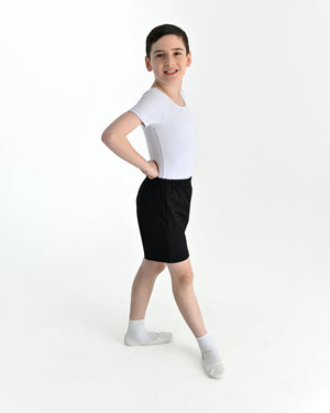 Young dancer wearing the Essential Boys Basic Dance Shorts in Black