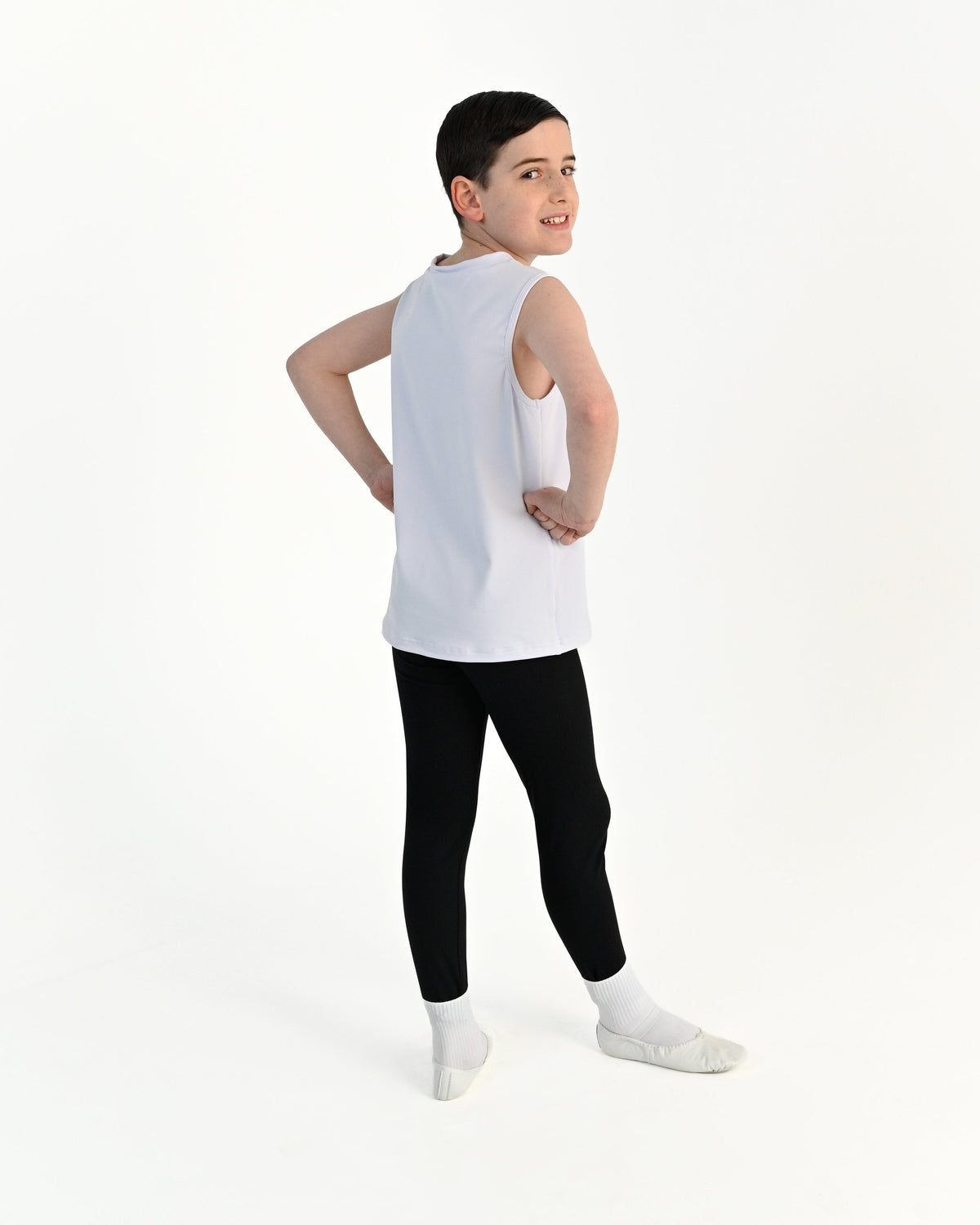 Young dancer wearing the Essential Boys Dance Tank in White, alternate view