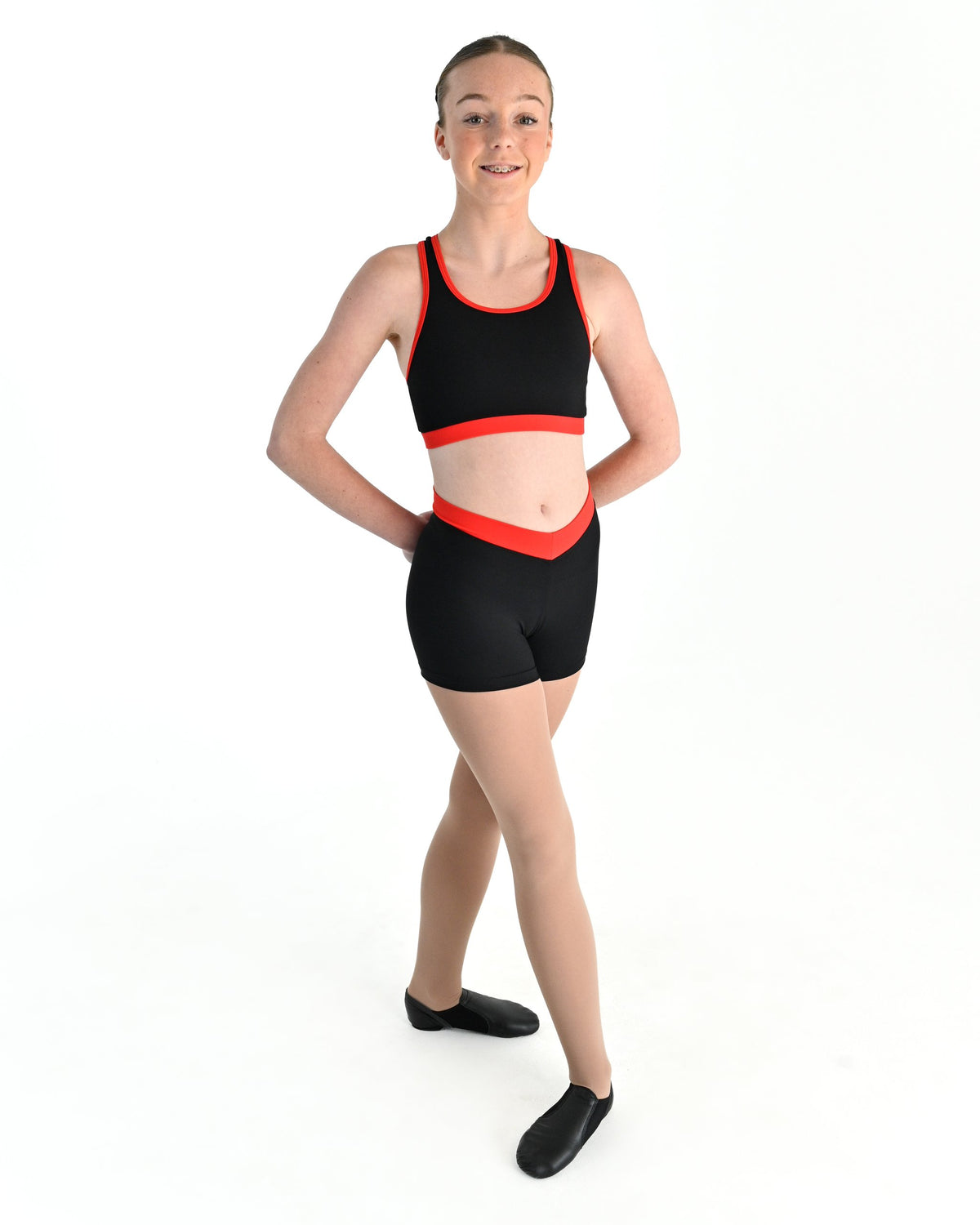 Young dancer wearing the V Band Shorts in Red