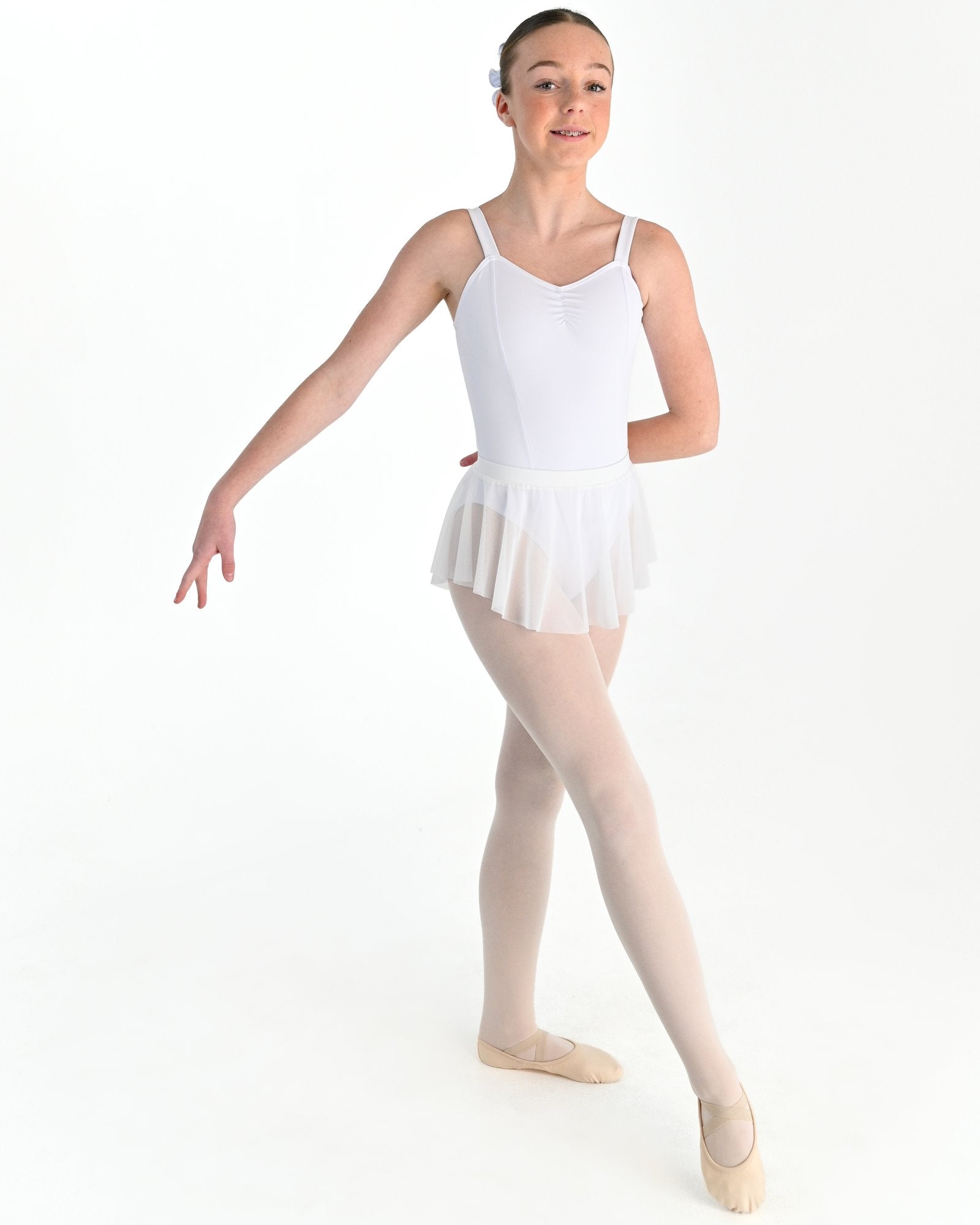 Young dancer wearing the Estelle stretch mesh pull on ballet skirt in White
