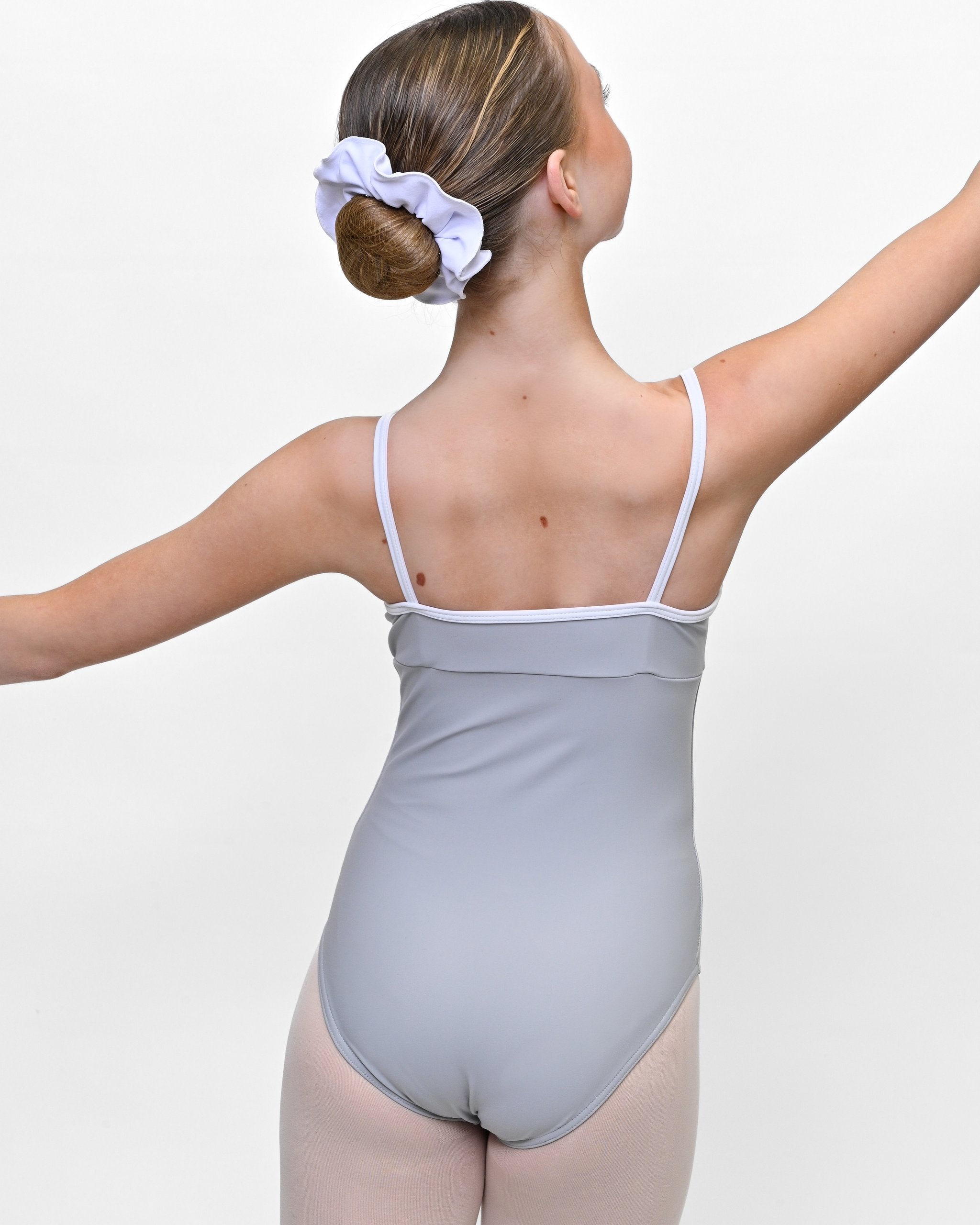 Young dancer wearing the Lillian V-Neck Leotard with Contrast Trim in Grey/White, alternate view