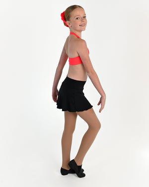 Young dancer wearing the Mila dance skort with fitted shorts underneath in Black, alternate view
