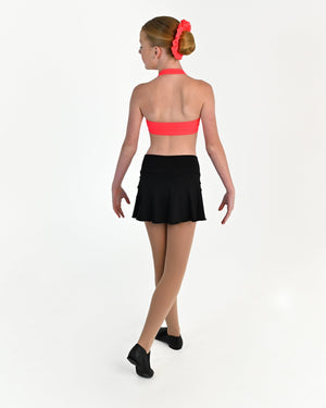 Young dancer wearing the Mila dance skort with fitted shorts underneath in Black, alternate view