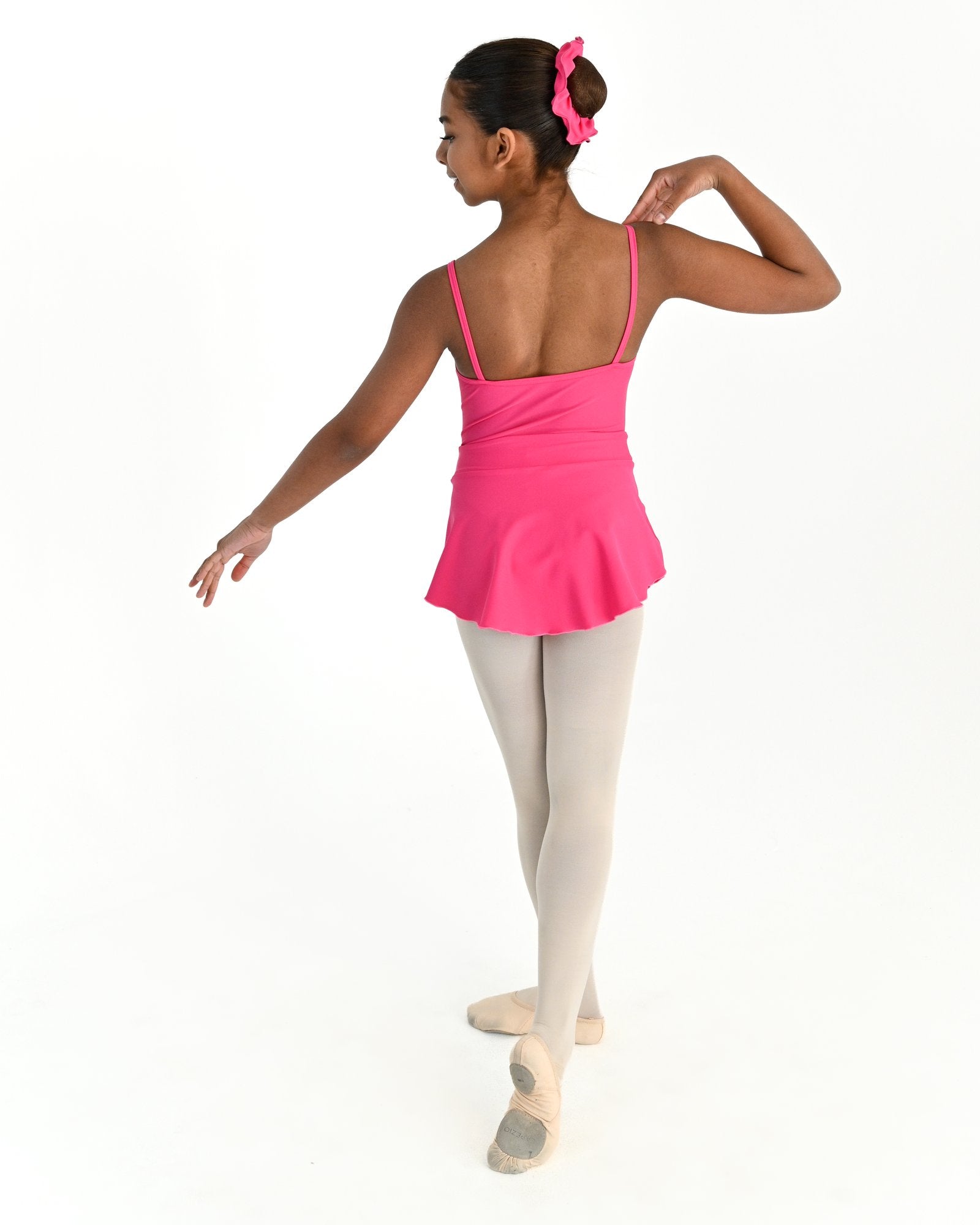Young dancer wearing the Prima high low pull on ballet skirt in Hot Pink, alternate view