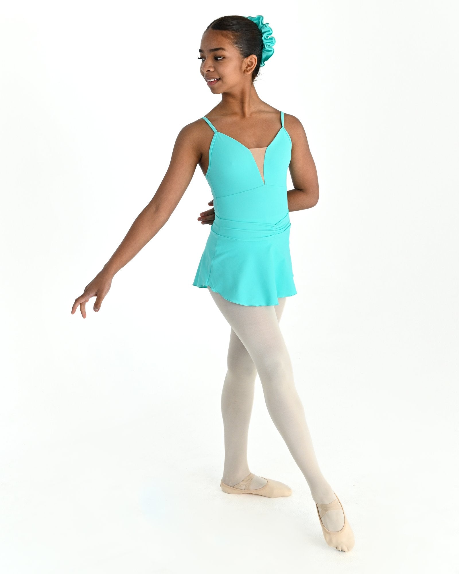 Young dancer wearing the Prima high low pull on ballet skirt in Mint