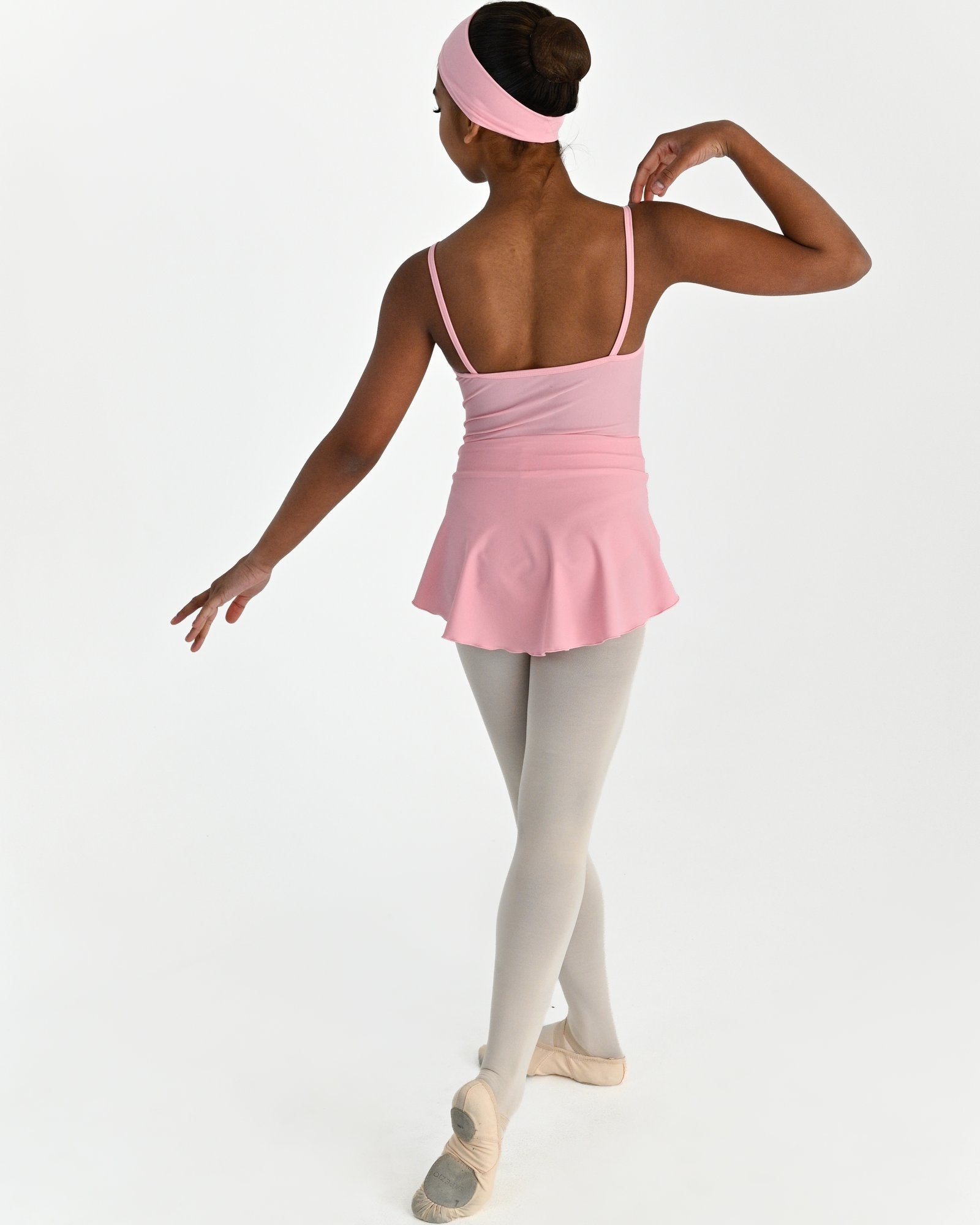 Young dancer wearing the Prima high low pull on ballet skirt in Pink, alternate view