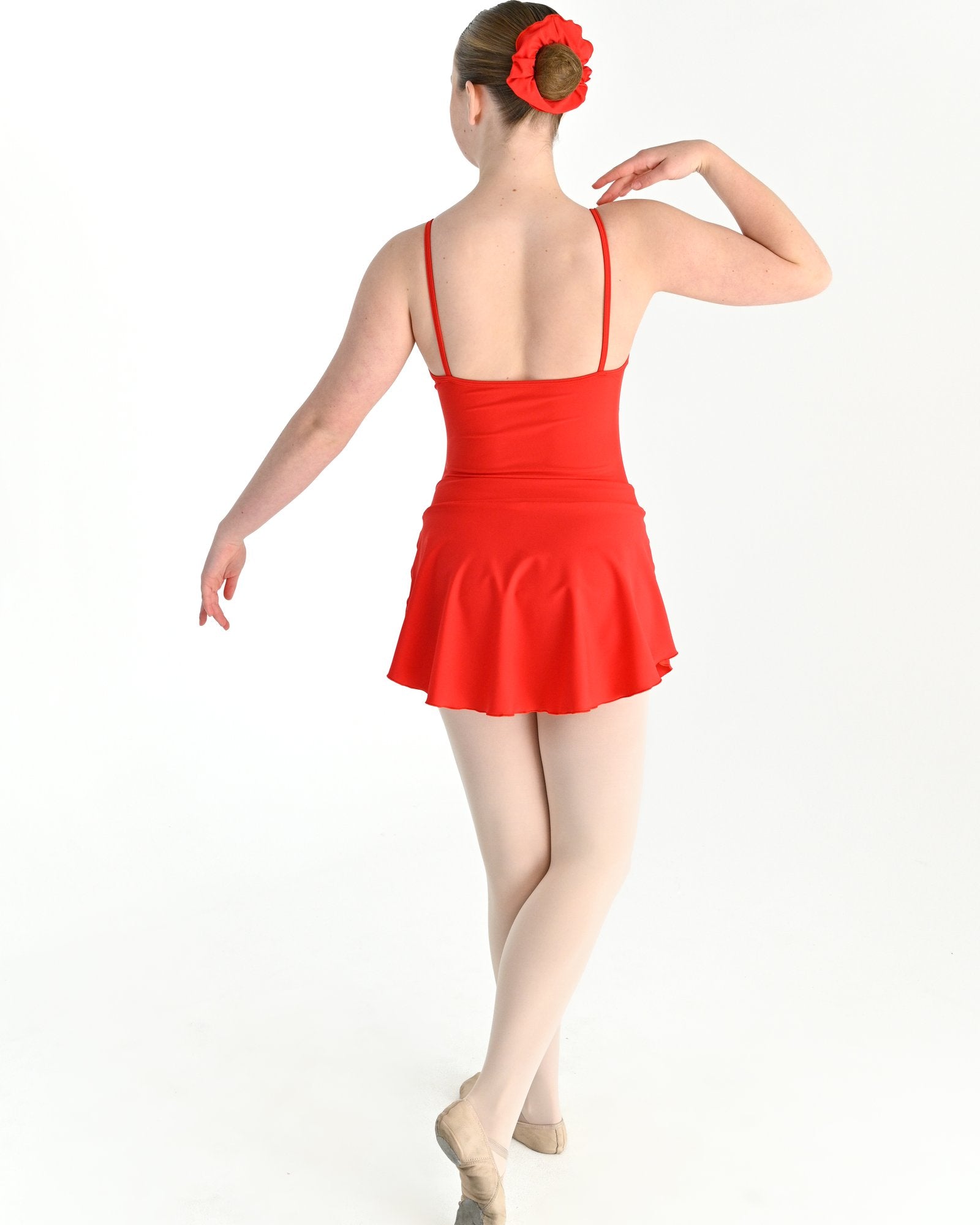 Young dancer wearing the Prima high low pull on ballet skirt in Red, alternate view