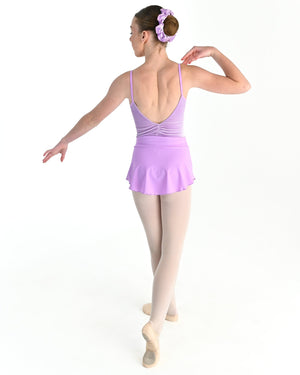 Young dancer wearing the Prima high low pull on ballet skirt in Wisteria, alternate view