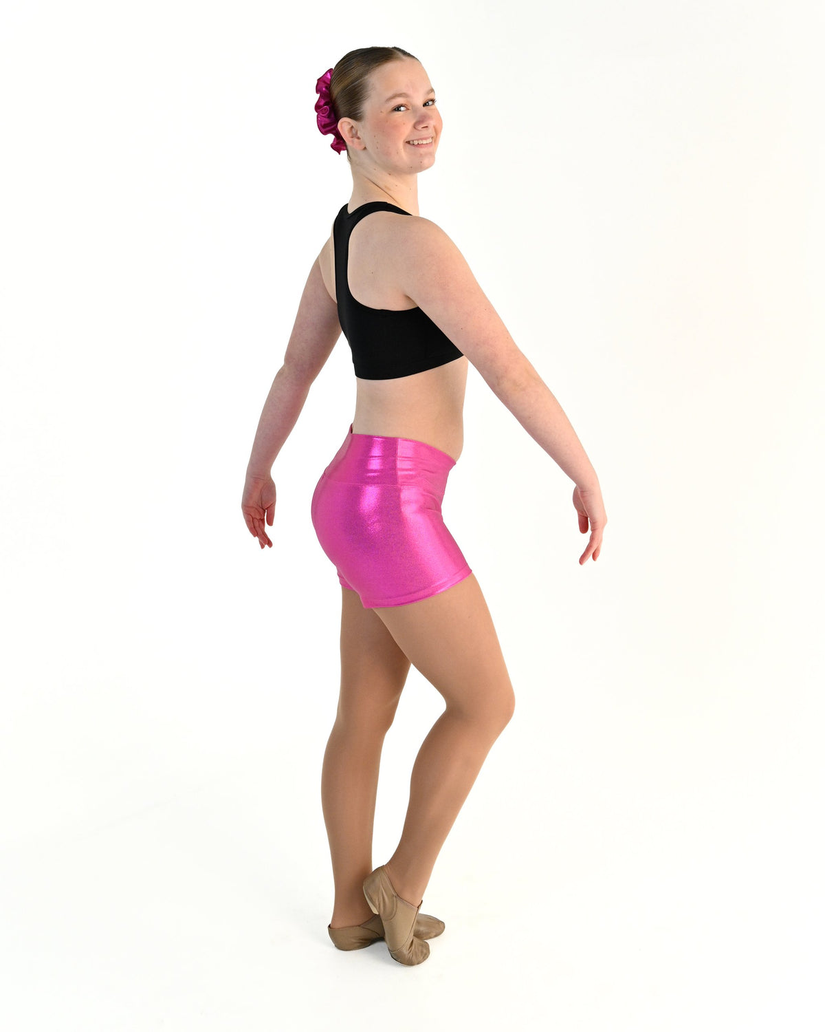 Young dancer wearing the Sienna Shorts in Electric Pink, alternate view