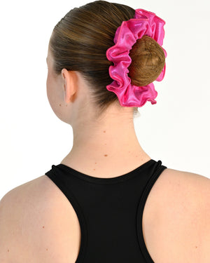 Young dancer wearing the Sienna Scrunchie in Electric Pink