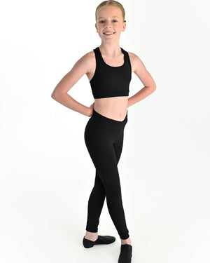 Young dancer wearing the Violet crossed back dance crop top with contrast binding in Black