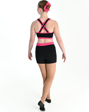 Young dancer wearing the Violet crossed back dance crop top with contrast binding in Hot Pink, alternate view