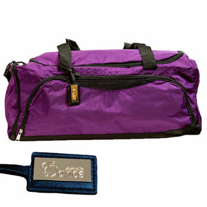 A purple duffle bag with black straps, a mesh compartment on the side, and an accompanying luggage tag that reads 'Australia Dance'.